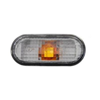 Kuva TYC 18 5235 15 2 Vilkku Savunharmaa Molemminpuolin, asennus sivulle Lampun kannalla Soikea VOLKSWAGEN: Passat B5 Sedan, Transporter 5, Golf 4
